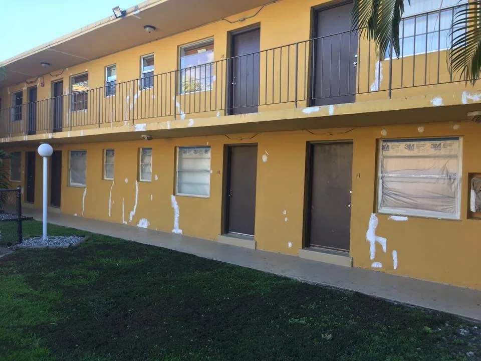 Multifamily exterior with visible repair preparation.