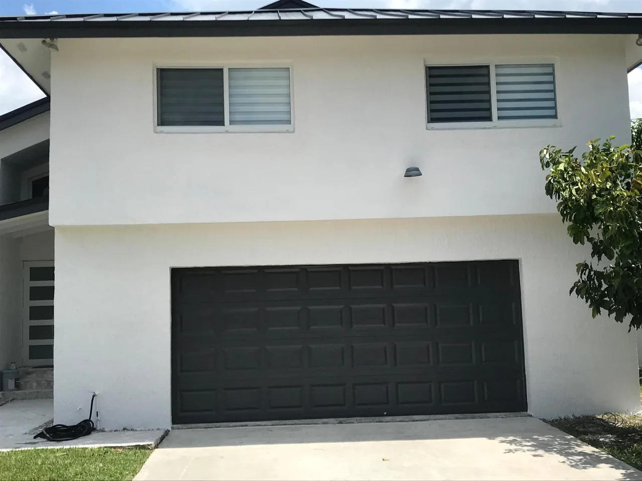 Garage and upper-level facade